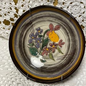 Handcrafted and hand painted pottery wall plate